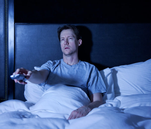Man watching late night television